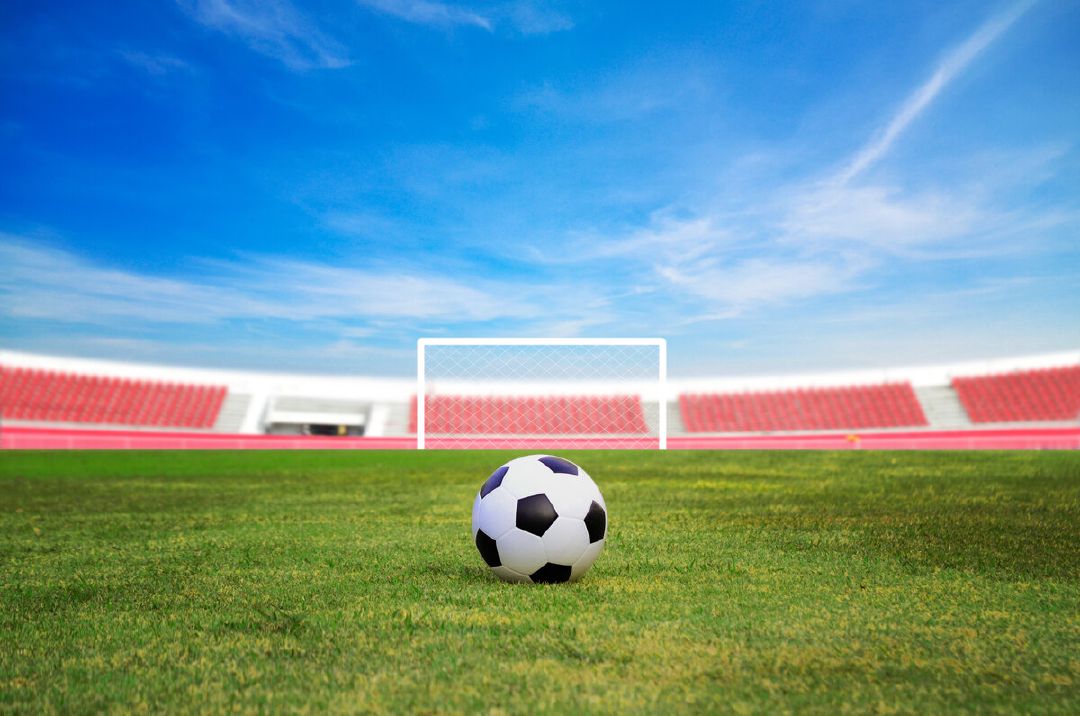 images/soccer-ball-field-against-blue-sky.jpg