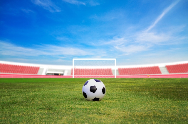 images/soccer-ball-field-against-blue-sky.jpg