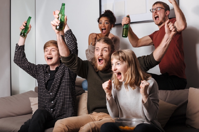 images/group-joyful-friends-sitting-sofa-happily-screaming-while-watching-tv-together-with-chips-beer-home.jpg